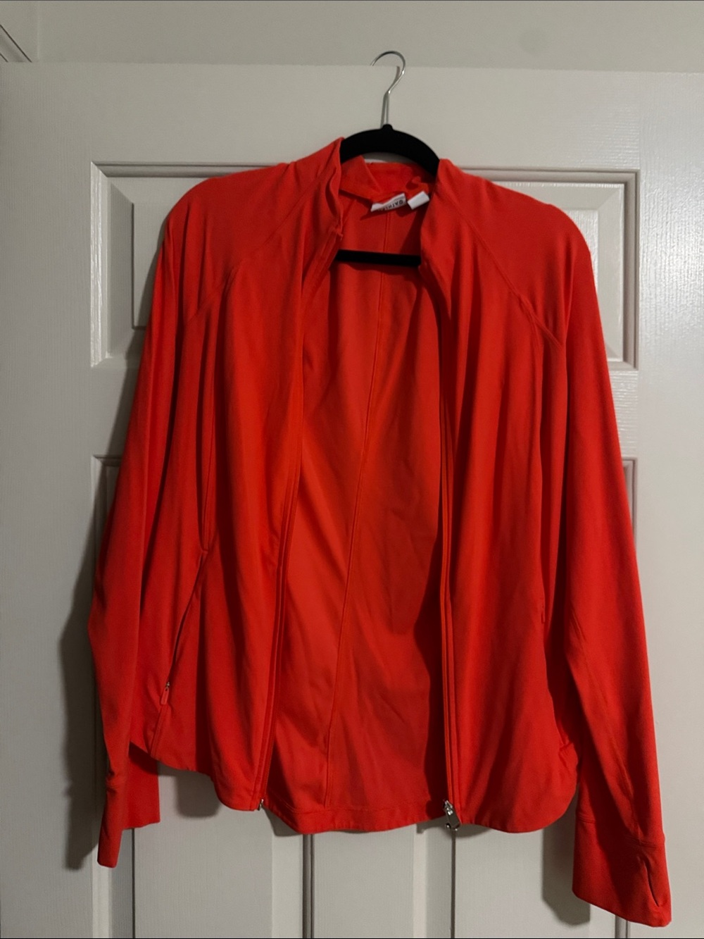 Athleta salutation jacket in flame color . Size large/tall